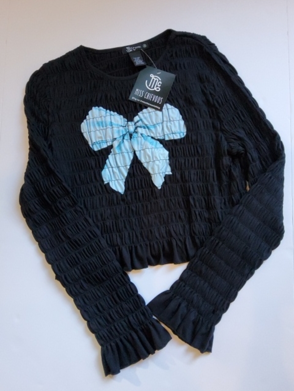 Miss Chievous Black Smocked Long Sleeve Top with Light Blue Bow Graphic - NWT